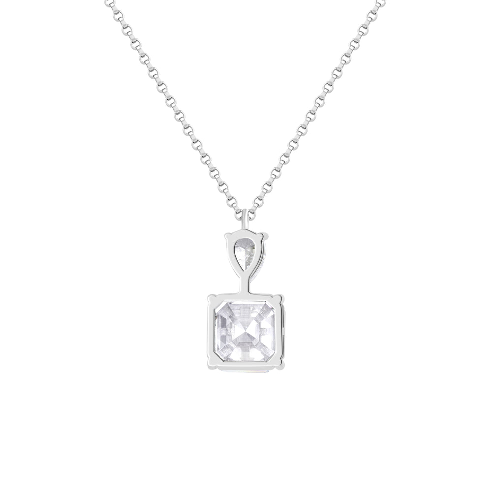 This pendant features two exquisite components - A prominent Asscher-cut white simulated diamond takes center stage, crowned by a smaller pear-shaped white diamond, creating a harmonious and elegant design.