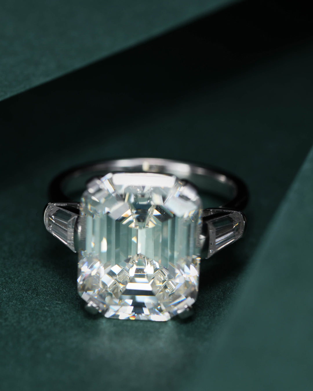 Classic Emerald Cut Diamond Ring with Side Stones