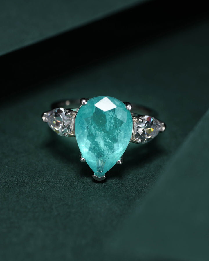 Tear of Joséphine: Pear Cut Blue-Green Diamond Ring with White Diamond Accents