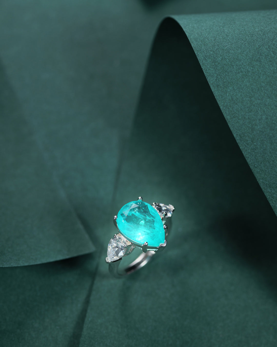 Tear of Joséphine: Pear Cut Blue-Green Diamond Ring with White Diamond Accents