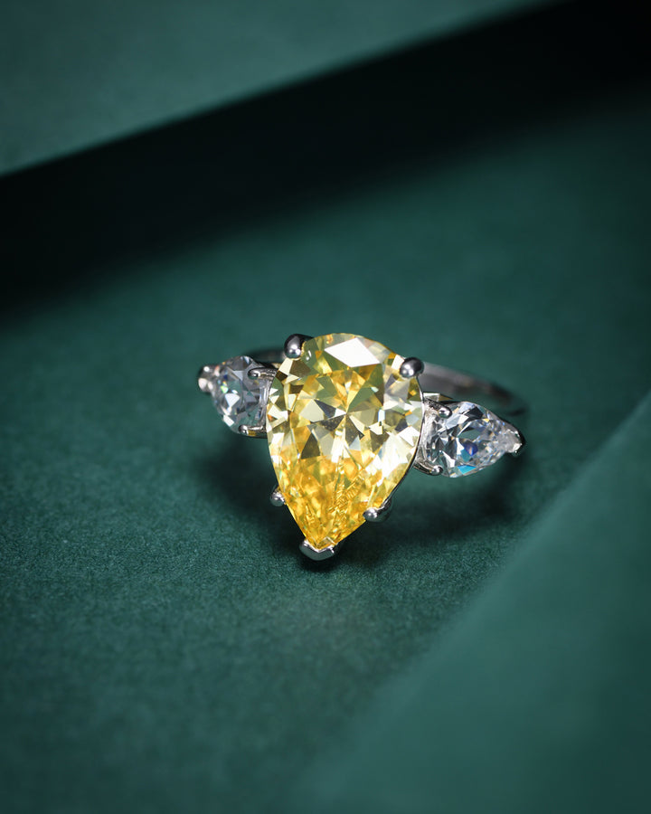 Tear of Joséphine: Pear Cut Yellow Diamond Ring with White Diamond Accents