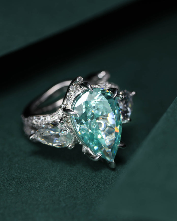 Tear of Joséphine: Blue-Green Pear Cut Diamond Ring with Crossed Branch Band